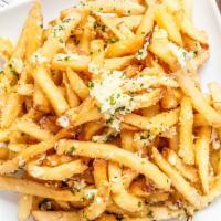 Truffle Parmesan Fries · White truffle oil, Reggiano cheese.