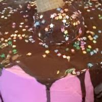 Round Ice Cream Celebration Cake · Layers of freshly made premium vanilla and chocolate ice cream, separated by a layer of our ...