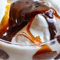 Hot Caramel Sundae · Classic vanilla soft serve sundae topped with rich hot caramel, whipped cream and a cherry.