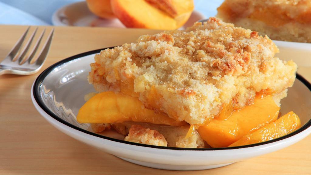 Peach Cobbler · Cinnamon and peaches with crumbly butter crust.