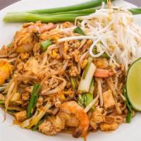 Pad Thai · Sautéed rice noodles with tofu, bean sprouts, egg. Served with peanuts and lime wedges.