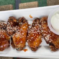 Wings · Spicy jerk, Asian Chile, BBQ dry rub.