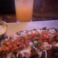 Stuffed Sweet Plantain · Sweet plantain topped with ground beef & baked on mozzarella.