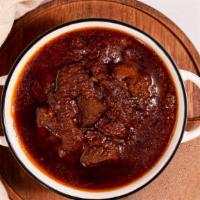 Siga Wot · Tender beef stew slow cooked for hours in a caramelized onions and berbere sauce. Traditiona...