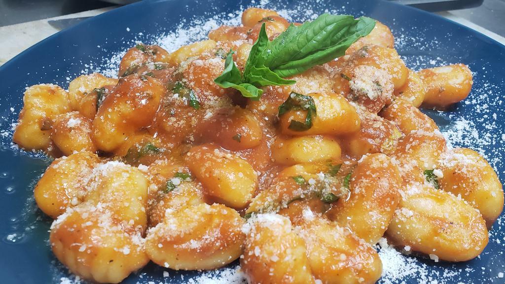 Gnocchi · Vegetarian. 
Comes with tomato sauce, basil, and Parmesan cheese.