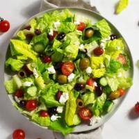 Greek Salad · Feta cheese, tomato, cucumber, onions, and olives with your choice of greens and dressing.