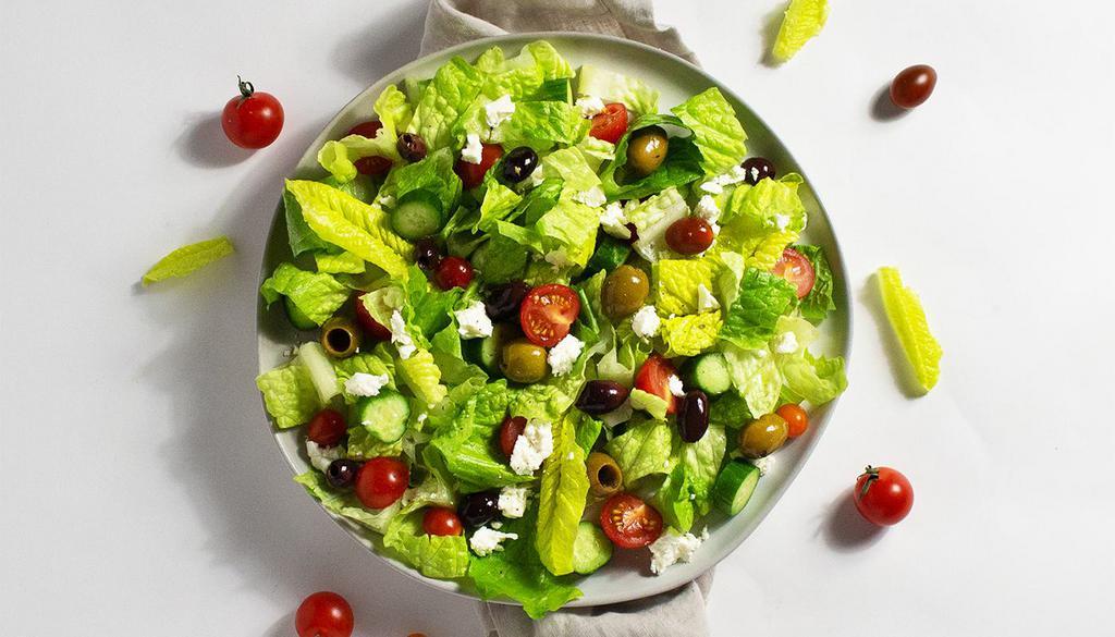 Greek Salad · Feta cheese, tomato, cucumber, onions, and olives with your choice of greens and dressing.