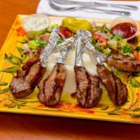 Lamb Chops Platter · Grilled marinated lamb chops with grilled vegetables.