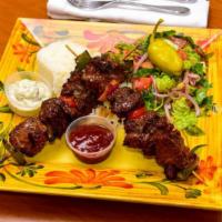 Shish Kebab · Marinated Boneless Lamb Leg with Tzatziki Sauce.
