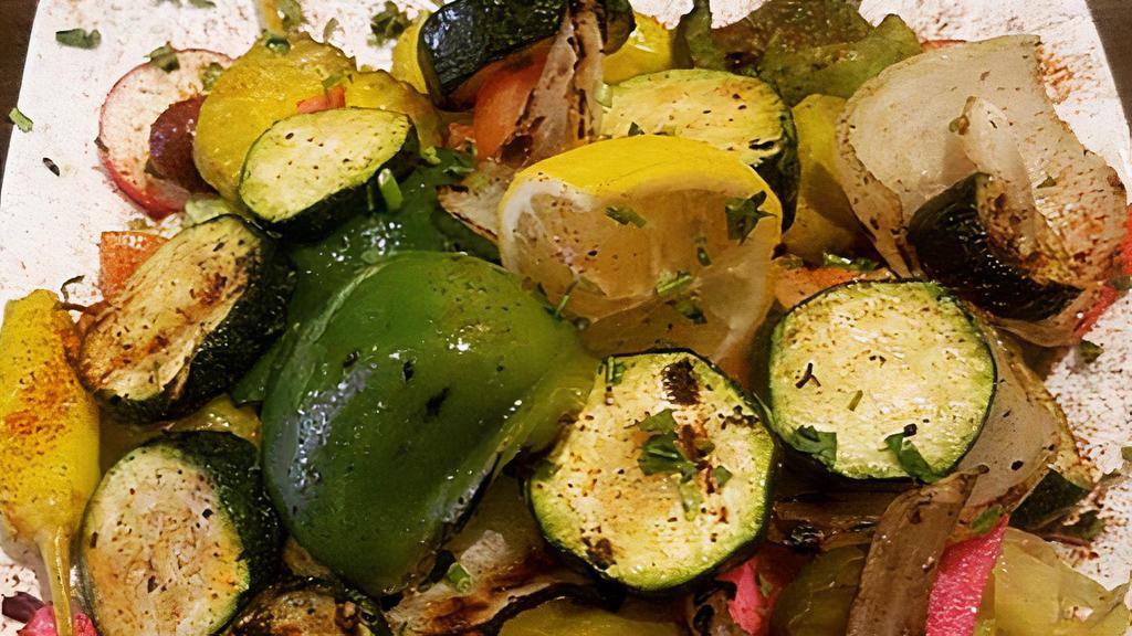 Grilled Vegetable Salad · Eggplant, squash, onion, green pepper over lettuce, tomato and cucumber.