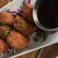 Pork Belly Croquettes
 · Crispy with sweet, sour, and savory hoisin.
