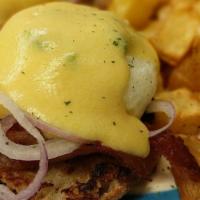 Spicy Bacon Onion Benedict · English muffin, crispy bacon, onion, poached eggs, and hollandaise sauce.