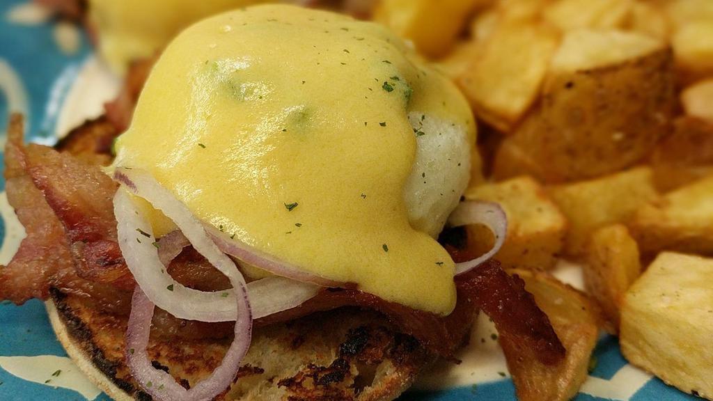 Spicy Bacon Onion Benedict · English muffin, crispy bacon, onion, poached eggs, and hollandaise sauce.