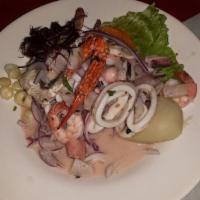 Ceviche Mixto · A variety of cooked and grilled seafood, marinated with ceviche juices. Served with glazed s...