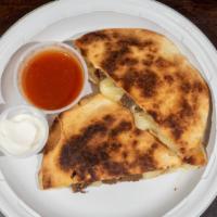  Jack Cheese & Grilled Steak Quesadilla · Cooked tortilla that is filled with cheese and folded in half.