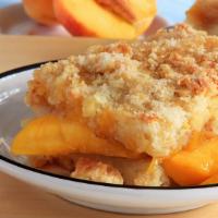 Peach Cobbler · Cinnamon peaches with crumbly butter crust.