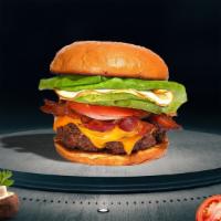Breakfast Breaker Burger · American beef patty topped with bacon, fried egg, avocado, melted cheese, lettuce, tomato, o...