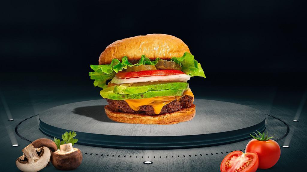 Cadet Cado Burger · American beef patty topped with avocado, melted cheese, lettuce, tomato, onion, and pickles on a bun.