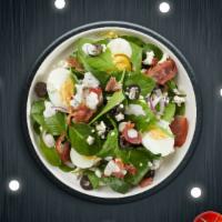 Spinach Splash Salad · Spinach, feta, bacon, onion, olives, and two hard-boiled eggs tossed with house dressing.