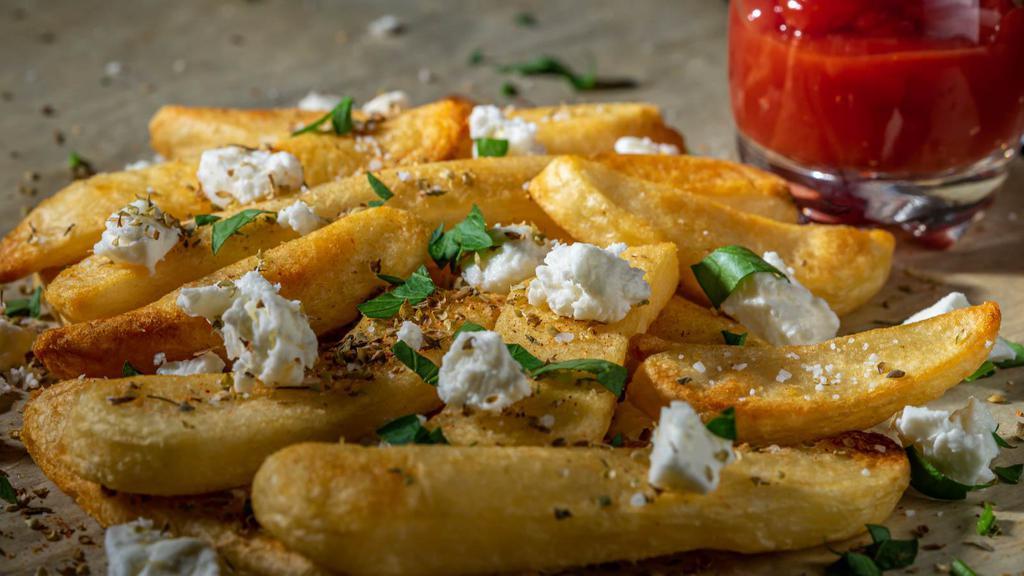 Greek Fries · A must try! Our signature golden, crispy fries seasoned with oregano, dill, garlic and house seasonings.
