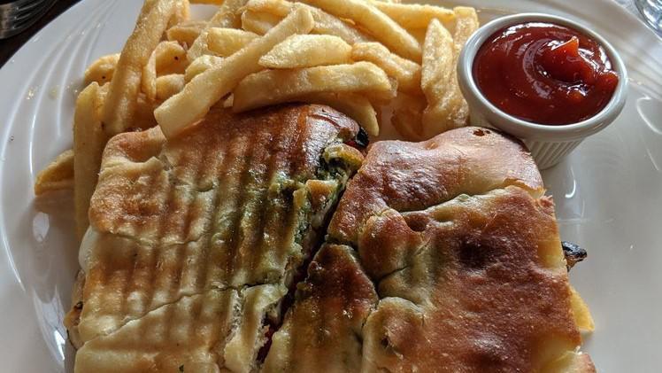 Italiano Panini · Grilled chicken, fresh mozzarella, sweet peppers topped with pesto sauce.