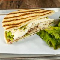 Panini With Tuscan Style Grilled Chicken · Grilled chicken breast and fresh mozzarella topped with baby artichoke hearts, sliced ripe t...