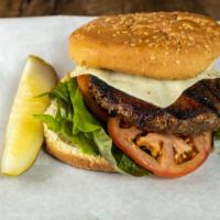 Chargrilled Sirloin Burger · A colossal size ground sirloin steak burger topped with leaf lettuce, sliced ripe tomatoes, ...