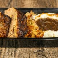 Platter Meatloaf In Brown Gravy · Homemade meatloaf smothered in brown gravy and topped with a touch of sauteed onions.