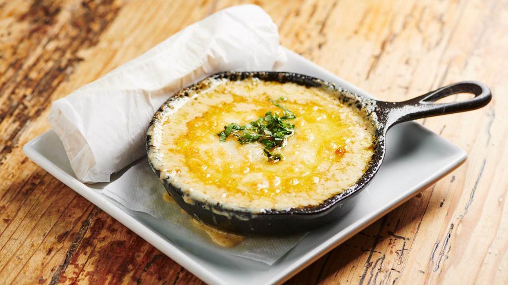 Queso Fundido · Melted cheese served with tortilla chips