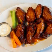 Chicken Wings · Sweet & Spicy served with Carrots & Celery. Blue Cheese Dressing