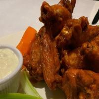 Buffalo Wings · Spicy buffalo sauce, blue cheese dressing, celery and carrot sticks.