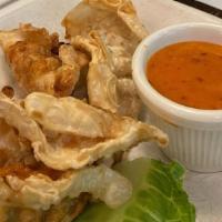 Chicken Pot Stickers · Crispy dumplings with a sweet and hot chili sauce.
