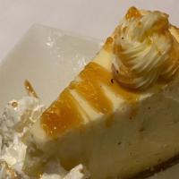 Ny Cheesecake · Topped with whipped cream & caramel drizzle