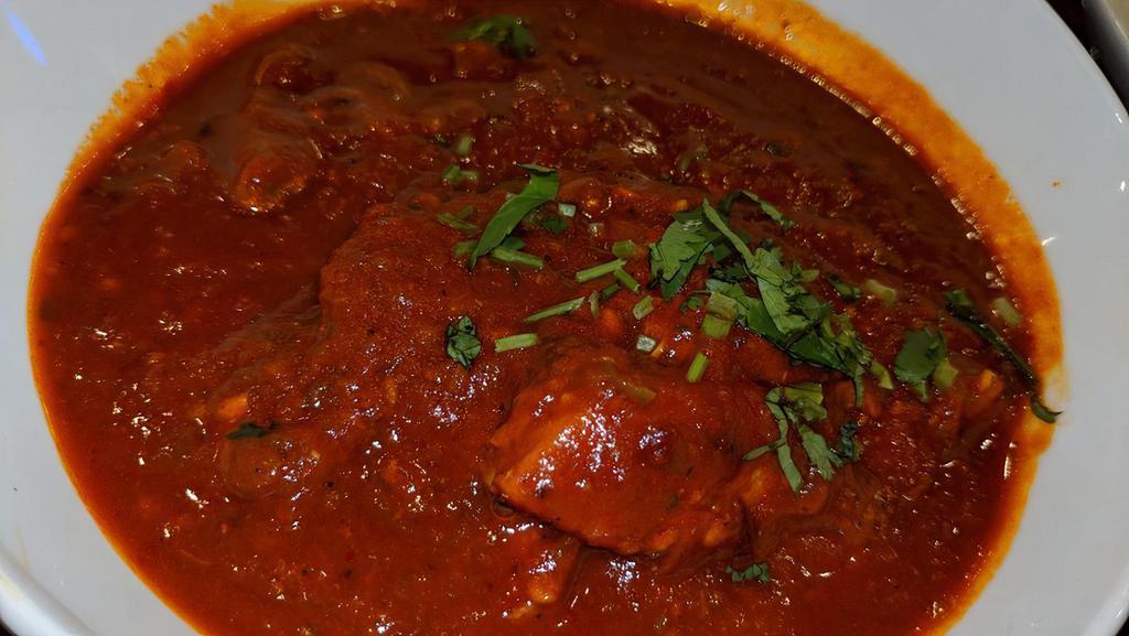 Vindaloo · Goa’s gift to the world. Curry infused with Kashmiri chilly peppers, garlic. Spices and vinegar.