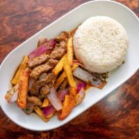 Lomo Saltado · Peruvian Stir-Fried Beef With Onions, Tomatoes, And French Fries. Rice On The Side.