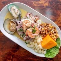 Ceviche Mixto · Mixed Seafood Marinated With Lime Juice. (Served Cold).