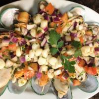 Choros A La Chalaca (12) · Mussels Topped With Peruvian Pico De Gallo (Served Cold).