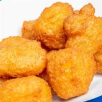 Corn Nuggets · Fried dough filled with pockets of sweet corn kernels.