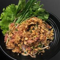 Nam Khao Tod · Crispy rice salad with sour pork sausage, peanut, ginger, shallot, scallion, and cilantro.