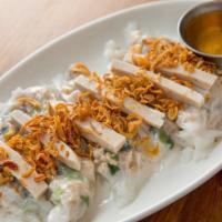 Hug Esan Pork Crepe · Ground pork and scallions wrapped in soft rice paper served with pork sausages, fried shallo...
