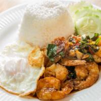 Pad Ka Prow · Basil sauce with ground meat, holy basil, garlic, and chili served over rice and fried egg o...