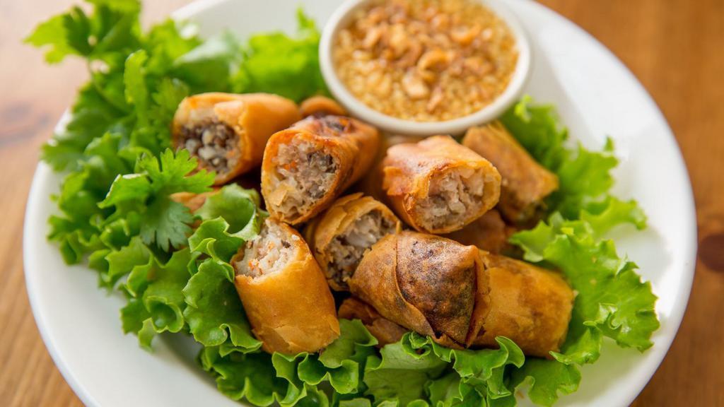 Pork Spring Rolls · Egg, carrots, mushrooms, onions, bean sprouts, and glass noodles with homemade tamarind sauce.