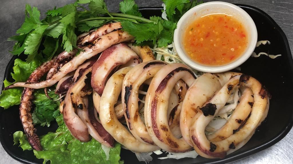 Grilled Squid · With chili lime sauce.