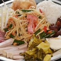 Hug Esan Papaya Salad · Choice of Tum Thai or Tum Plara with sour sausages, pork sausages, fried marinated pork, cri...