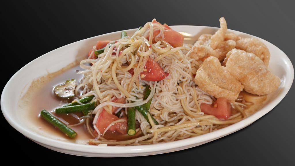 Tum Sua · Papaya salad with vermicelli noodle, pickled fish sauce, and crispy pork skin. (Fishy)