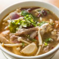 Tom Zabb · Pork broth based. Spicy and sour soup with mushrooms, tomatoes, and scallions.