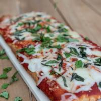 Tuscan Style Margharita Pizza · A base of our tangy marinara sauce topped with a blend of shredded and fresh mozzarella and ...