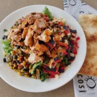 Adobo Lime Chicken · rotisserie chicken on top of seasonal mixed greens, tossed with fire roasted corn and black ...