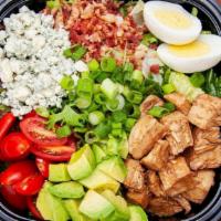 Cosi® Cobb · protein rich rotisserie chicken and hard boiled egg on top of seasonal mixed greens tossed w...