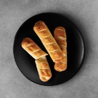 Stuffed Breadsticks · Our breadsticks are stuffed with mozzarella cheese. We then drizzle it with garlic butter an...